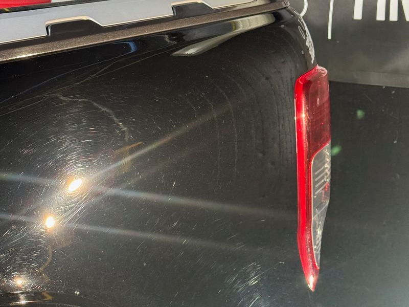 Before: swirl marks and fine scratches across the rear quarter of a black Ford Ranger, picked out under my studio lights
